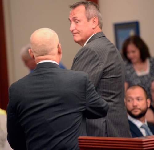 Al Hartmann |  The Salt Lake Tribune

Former Utah Attorney General Mark Shurtleff speaks with his attorney, Richard Van Wagoner, after pleading not guilty to five felonies and two misdemeanors in Salt Lake City on Monday, June 29, 2015.