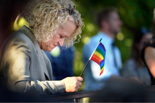 Scott Sommerdorf   |  The Salt Lake Tribune
Mayoral candidate Jackie Biskupski pauses as it's mentioned during a speech that those activists who came before deserve to be remembered at this time. She listened to speeches at a rally in City Creek Park to celebrate the SCOTUS ruling, Friday, June 26, 2015.