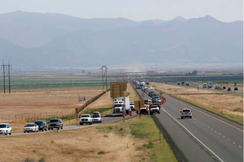 Northbound 1-15 traffic is backed up for miles July 8, 2007, near Beaver, Utah, due to the Milford Flat wildfire.   Rick Egan/The Salt Lake Tribune
