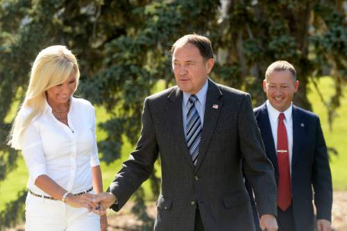 Al Hartmann |  The Salt Lake Tribune
Nannette Wride, widow of slain Utah County Sheriff Sgt. Cory Wride walks with Gov. Gary Herbert to police memorial outside the Utah Capitol to sign HB 288, which provides death benefits for Utah peace
officers and firefighters killed in the line of duty.  Rep. Paul Ray, the bill's sponsor at right.