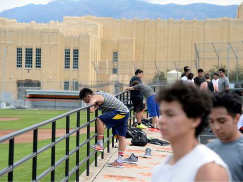 Al Hartmann |  The Salt Lake Tribune
Next season's Ogden High School football team players rest and call it a day after a summer conditioning workout Thursday June 11, 2015. The team belongs in Class 4A purely by enrollment numbers, but the football program argued during recent UHSAA realignment meetings that, based on a historic lack of competitiveness, it should be dropped down a classification or two to allow the program to rebuild.