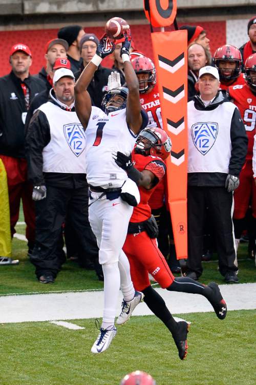 Chris Detrick  |  The Salt Lake Tribune
Arizona Wildcats wide receiver Cayleb Jones (1) can't make a catch while being covered by Utah Utes wide receiver Dominique Hatfield (15) during the game at Rice-Eccles Stadium Saturday November 22, 2014.