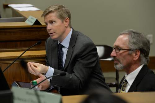 Francisco Kjolseth  |  The Salt Lake Tribune 
Jonathan Johnson, left, and Rep. Gage Froerer, R-Huntsville discuss the changes made to HB94, the investigational drug and device access for terminally ill patients during a committee meeting on Monday, Feb. 9, 2015.