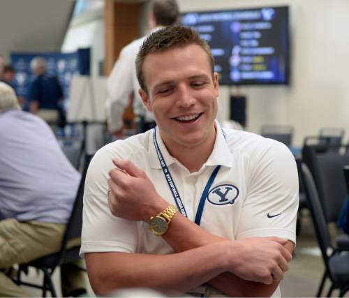 Al Hartmann |  The Salt Lake Tribune
BYU quarterback Taysom HIll answers reporter's question during informal interviews Tuesday June 24 for BYU football media day in Provo.