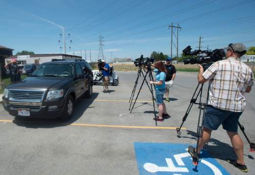 Rick Egan  |  The Salt Lake Tribune

Members of the media films West Valley Police Officer, Dana Pugmire, as he sits in his car for 15 minutes in the heat of the day, during a press conference to illustrate the dangers of leaving children and pets in hot cars, Thursday, July 2, 2015.