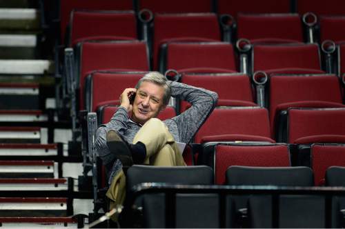 Scott Sommerdorf   |  The Salt Lake Tribune
Utah Athletic Director, Dr. Chris Hill speaks on his phone as the Utes practice at the Moda Center in Portland, Wednesday, March 18, 2015.