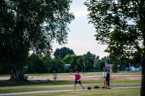 Chris Detrick  |  The Salt Lake Tribune
Disc golfers play at Valley Regional Park Thursday July 2, 2015.   Valley Regional Park is being named after Gary Swensen, a longtime County Parks and Recreation boss who developed this facility and many other parks in the county.