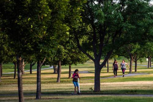 Chris Detrick  |  The Salt Lake Tribune
People enjoy Valley Regional Park Thursday July 2, 2015.   Valley Regional Park is being named after Gary Swensen, a longtime County Parks and Recreation boss who developed this facility and many other parks in the county.