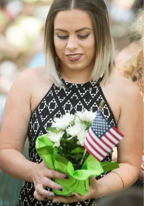 Rick Egan  |  The Salt Lake Tribune


Andrea Castaneda, originally from Argentina,  was sworn in as a new citizen of the United States during a ceremony at Scera Park, in Orem, Friday, July 3, 2015.