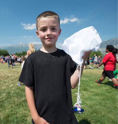 Rick Egan  |  The Salt Lake Tribune

Luke Filburg, Sandy holds the candy bar that was dropped from a plane by former Air Force Col Gal Halvorsen, at Scera Park, in Orem, Friday, July 3, 2015.