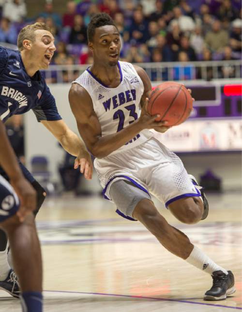 Rick Egan  |  The Salt Lake Tribune

Weber State Wildcats guard Richaud Gittens (23) drives towards the hoop, in basketball action BYU vs Weber State, at the Dee Events Center in Ogden, Saturday, December 13, 2014