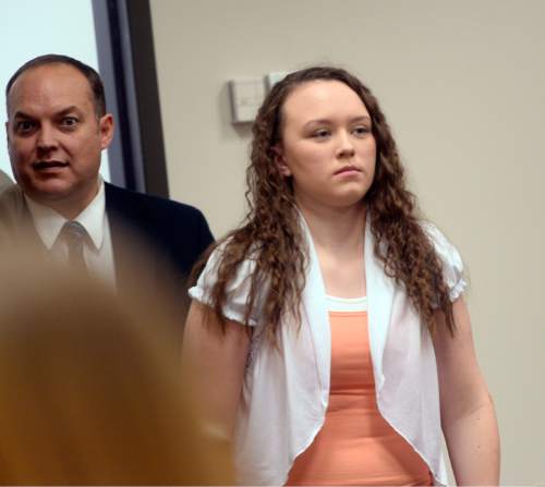 Al Hartmann  |  The Salt Lake Tribune
Meagan Grunwald, who is charged as an accomplice in a shooting spree that killed one police officer and wounded another on Jan. 30, 2014, enters Judge Darold McDade's courtroom in Provo Monday May 4, 2015, for the second week of trial.