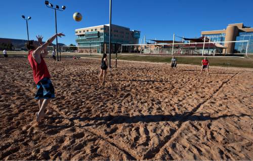 Dixie State College students play volleyball during a pick-up game on the sand volleyball courts on the campus of Dixie State Friday, Feb. 2, 2013.