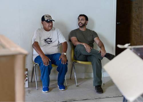 Scott Sommerdorf   |  The Salt Lake Tribune
Ahmed Mostafa, right, of Islamic Relief USA speaks with a Goshute man as Islamic Relief USA brought food to the Goshute Reservation in Ibapah, Thursday, July 9, 2015.