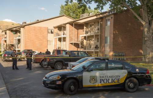 Rick Egan  |  The Salt Lake Tribune
Salt Lake City Police investigate a stabbing at the Cambridge Cove apartments on Saturday.