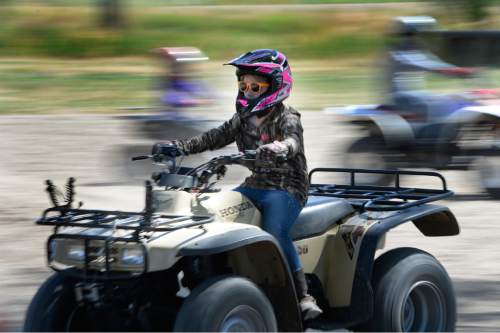 Scott Sommerdorf   |  The Salt Lake Tribune
Taylee Barnes runs the course during ATV training at the Weber County Fairgrounds on Saturday. Primary Children's Hospital teamed up with Safe Kids and the Weber-Morgan Health Department to offer a special one-day course designed to keep kids safe while riding ATVs.
