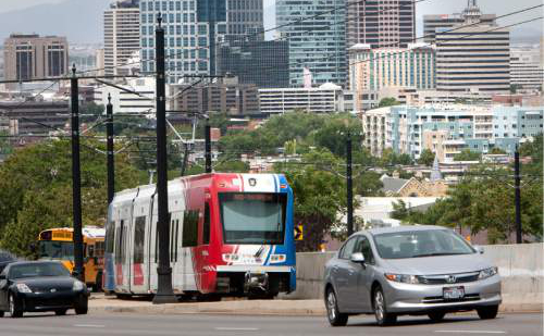 Steve Griffin |  Tribune file photo

A UTA TRAX train climbs out of downtown Salt Lake City as it heads to the University of Utah in Salt Lake City on Monday June 24, 2013.