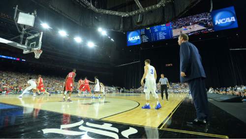 Steve Griffin  |  The Salt Lake Tribune

University of Utah head coach Larry Krystkowiak calls the defensel during first half action in the University of Utah versus Duke University Sweet 16 game in the 2015 NCAA Menís Basketball Championship Regional Semifinal game at NRG Stadium in Houston, Friday, March 27, 2015.