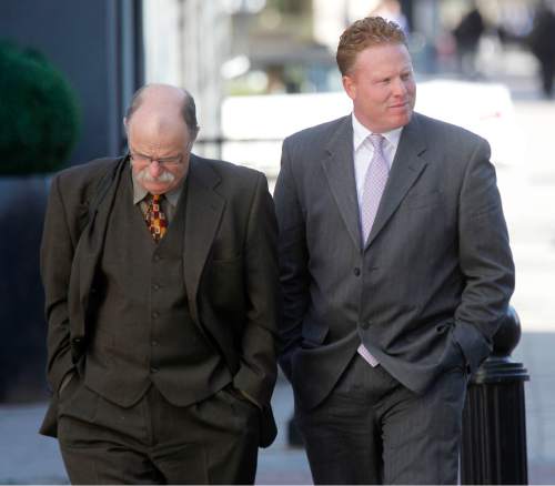Al Hartmann  |  The Salt Lake Tribune
Jeremy Johnson, leaving court with defense lawyer Ron Yengich earlier this year, said Monday he could not comment on the latest ruling because he is under a court order not to discuss the criminal case. ìIíd love to comment but I am gagged,î Johnson wrote in a text message. ìNo First Amendment for me.î
