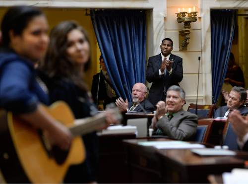 Scott Sommerdorf   |  The Salt Lake Tribune

Senator Alvin Jackson, R-Highland applauds along with other members of the Senate after a singing group of Native American singers sang "The Deer Song" to open the day in the Utah Senate, Thursday, February 12, 2015. The group is made up of Lumbee and Navajo people.
