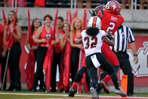 Chris Detrick  |  The Salt Lake Tribune
Utah Utes wide receiver Kenneth Scott (2) scores a touchdown past Idaho State Bengals Vai Peko during the first half of the game at Rice-Eccles stadium Thursday August 28, 2014. Utah is winning the game 35-7.