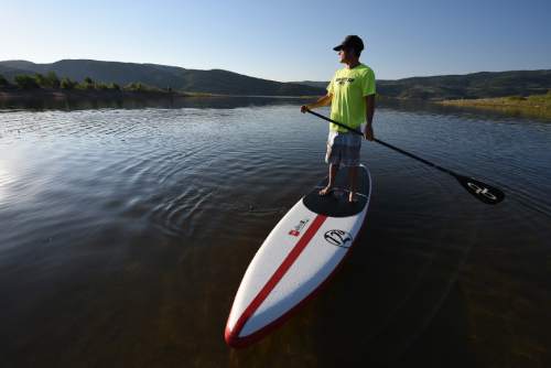 Francisco Kjolseth | The Salt Lake Tribune
Trent Hickman of Park City grew up with a love for water sports that developed from both living next to the Provo river and visits to Malibu where his mother grew up. Later in life he divided his time between Utah for the skiing and Costa Rica to surf. It was then that his introduction to stand up paddle boarding known as SUP, sparked a new passion that he could do on the lakes and rivers of Utah.