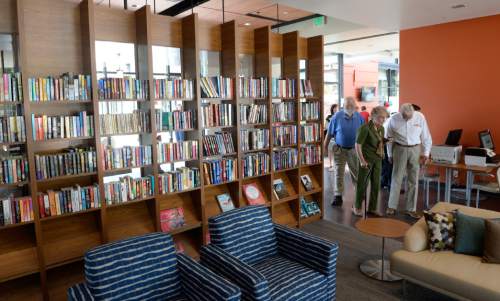 Al Hartmann  |  The Salt Lake Tribune 
People tour the reading room at the new Salt Lake County Midvale Senior Center at 7550 South Main St. which opened Wednesday July 15 with a ribbon cutting ceremony.