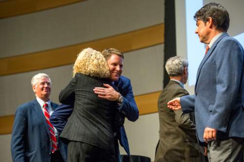 Chris Detrick  |  The Salt Lake Tribune
Businessman Dave Robinson and former state legislator Jackie Biskupski hug after the Salt Lake City Mayoral Debate at Salt Lake City's Main Library Thursday July 16, 2015.