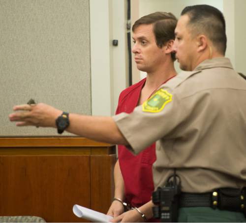 Steve Griffin  |  The Salt Lake Tribune

Joshua Scott Schoenenberger is led into court where he is charged with first-degree felony aggravated murder -- a potential death-penalty offense -- in the May 11 death of his girlfriend's 2-year-old son, James Sieger Jr. He appeared in court for the first time in front of Judge John R. Morris in 2nd District Court in Farmington, Monday, June 1, 2015.