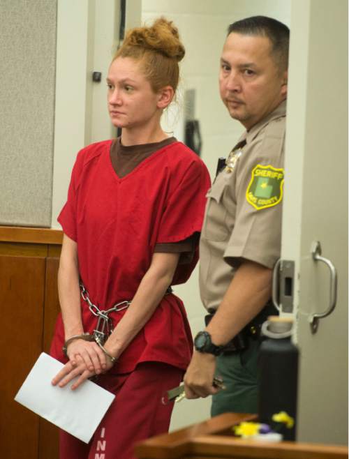 Steve Griffin  |  The Salt Lake Tribune

Jasmine Ruth Bridgeman, who is charged with second-degree felony obstructing justice for allegedly lying to police during the homicide investigation of her 2-year-old son, James Sieger Jr., is led into the courtroom of Judge John R. Morris in 2nd District Court in Farmington, Monday, June 1, 2015.