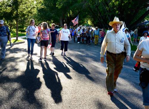 Scott Sommerdorf   |  The Salt Lake Tribune
Families walk in the five-mile commemorative Encampment Hike Saturday, July 18, 2015. The hike, which follows Emigration Creek through Salt Lake City, began at Donner Park and ended at First Encampment Park, near the site where the Mormon pioneers camped in the Salt Lake Valley on July 22, 1847.