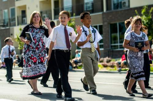 Chris Detrick  |  The Salt Lake Tribune
Members of the Bennion Utah West Stake participate in the annual Days of '47 Youth Parade through downtown Salt Lake City Saturday, July 18, 2015.