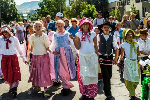 Chris Detrick  |  The Salt Lake Tribune
Members of the South Jordan Utah River Ridge Stake participate in the annual Days of '47 Youth Parade through downtown Salt Lake City Saturday, July 18, 2015.