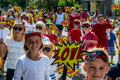Chris Detrick  |  The Salt Lake Tribune
New Frontier Heroes of the Willow Creek Stake participate in the annual Days of '47 Youth Parade through downtown Salt Lake City Saturday, July 18, 2015.