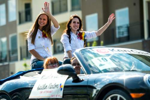 Chris Detrick  |  The Salt Lake Tribune
Days of '47 Royalty Madeline Kay Field, Queen, and Kaitlin Paxton, 2nd Attendant, participate in the annual Days of '47 Youth Parade through downtown Salt Lake City Saturday, July 18, 2015.