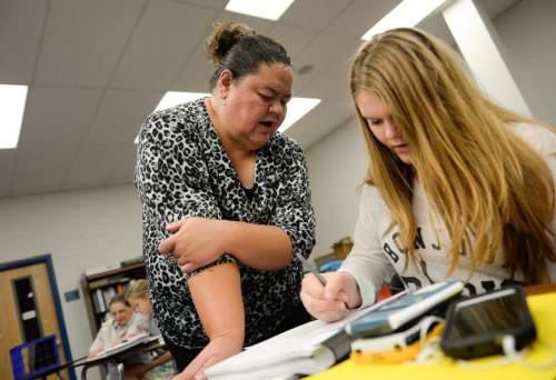 Francisco Kjolseth | The Salt Lake Tribune  
Math teacher Noelani Ioane works with Alexia Reiber, 14, as she accelerates her high school credits at Bingham High during a Summer math class program.