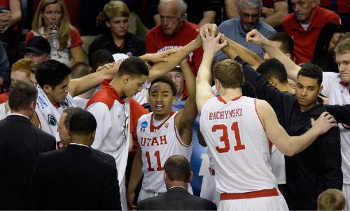 Scott Sommerdorf   |  The Salt Lake Tribune
Utah guard Brandon Taylor (11) leads the team in a post timeout moment during first half play. Utah defeated Stephen F. Austin 57-50 at the Moda Center in Portland, Thursday, March 19, 2015.
