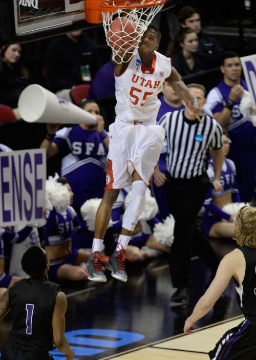 Scott Sommerdorf   |  The Salt Lake Tribune
Utah guard Delon Wright (55) dunks during first half play. Utah held a 26-19 lead over Stephen F. Austin at the half at the Moda Center in Portland, Thursday, March 19, 2015.