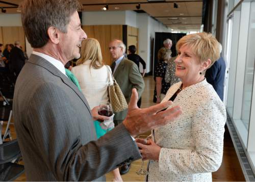 Francisco Kjolseth  |  The Salt Lake Tribune
Deborah Bayle, CEO of the United Way of Utah who retired July 1, speaks with Phil Cofield during her retirement party at the Gallivan Center on Thursday, June 11, 2015. Bayle was sometimes controversial as a CEO who revamped the United Way and its focus, away from being a fundraiser for many nonprofits to being focused on a specific community goal.