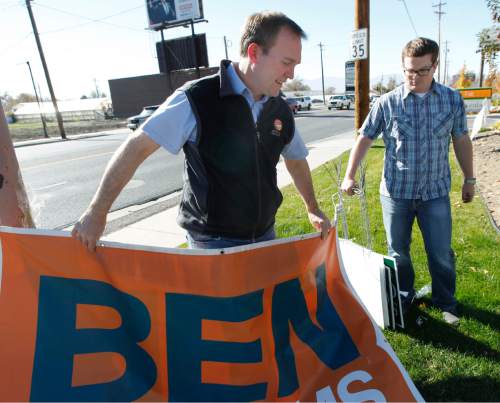 Al Hartmann  |  The Salt Lake Tribune
Newly elected Salt Lake County Mayor Ben McAdams, left, and  campaign manager Justin Miller take down political banners and signs from his campaign headquarters in Salt Lake City office Wednesday November 7.