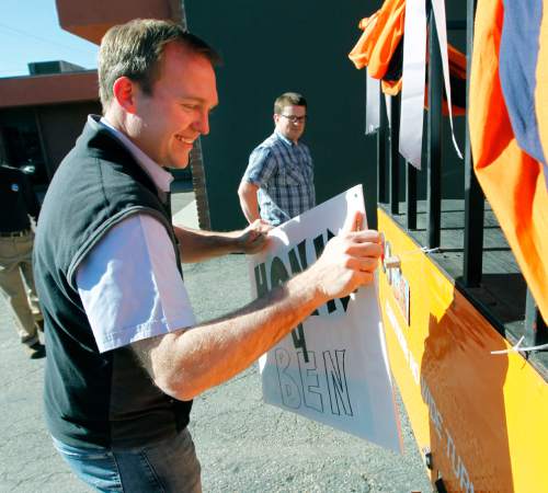 Al Hartmann  |  The Salt Lake Tribune
Newly elected Salt Lake County Mayor Ben McAdams, left, begins to tear down posters on his campaign bus at his Salt Lake City headquarters with  campaign manager, Justin Miller Wednesday November 7.