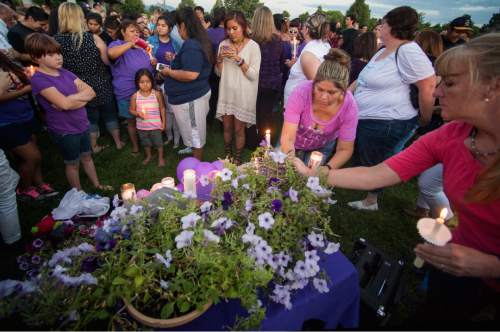 Rick Egan  |  The Salt Lake Tribune

Friends and family of Kailey Vijil gather for a candle light vigil, in memory of the 12-year-old West Valley City girl who died earlier this week, Sunday, July 19, 2015.