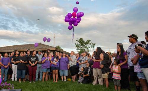 Rick Egan  |  The Salt Lake Tribune

Friends and family of Kailey Vijil release purple balloons as they gathered for a candle light vigil, in memory of the 12-year-old West Valley City girl who died earlier this week, Sunday, July 19, 2015.