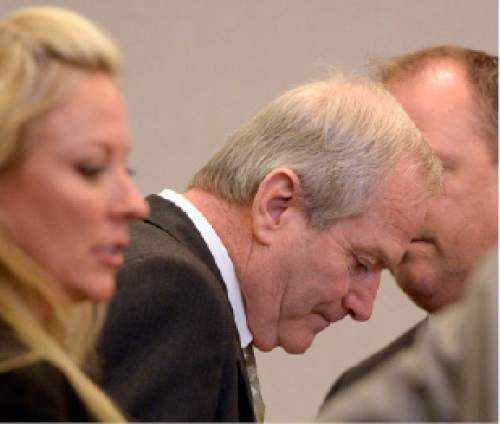 Al Hartmann  |  The Salt Lake Tribune
Former Canyons School District bus driver John Carrell, who is charged with sexually molesting two 5-year-old girls who rode on his bus stands with his defense lawyer Chelsea Koch, left, and investigator Nick DeLand for closing arguments in his trial in West Jordan Wednesday July 22.