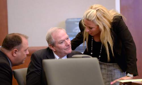 Al Hartmann  |  The Salt Lake Tribune
Former Canyons School District bus driver John Carrell, who is charged with sexually molesting two 5-year-old girls who rode on his bus confers with his investigator Nick DeLand, left, and defense lawyer Chelsea Koch for closing arguments in his trial in West Jordan Wednesday July 22.