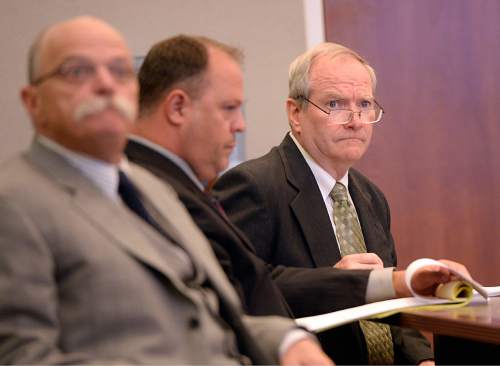 Al Hartmann  |  The Salt Lake Tribune
Former Canyons School District bus driver John Carrell, right, who is charged with sexually molesting two 5-year-old girls who rode on his bus sits with his investigoator Nick DeLand, and defense lawyer Ron Yengich, left, for closing arguments in his trial in West Jordan Wednesday July 22.