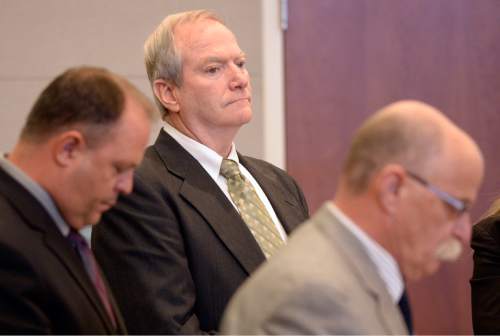 Al Hartmann  |  The Salt Lake Tribune
Former Canyons School District bus driver John Carrell, center, who is charged with sexually molesting two 5-year-old girls who rode on his bus sits with his investigator Nick DeLand, left, and defense attorney Ron Yengich, right, for closing arguments in his trial in West Jordan Wednesday July 22.