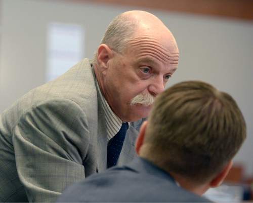 Al Hartmann  |  The Salt Lake Tribune
Defense lawyer Ron Yengich, left , confers with prosecuter Nathan Evershed before the closing arguments of former Canyons School District bus driver John Carrell in his trial in West Jordan Wednesday July 22.
Carrell is charged with sexually molesting two 5-year-old girls who rode on his bus.