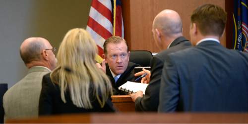 Al Hartmann  |  The Salt Lake Tribune
Judge L. Douglas Hogan, calls defense and prosecution lawyers to his bench during closing arguments in West Jordan Wednesday July 22 in the trial of former Canyons School District bus driver John Carrell, who is charged with sexually molesting two 5-year-old girls who rode on his bus.