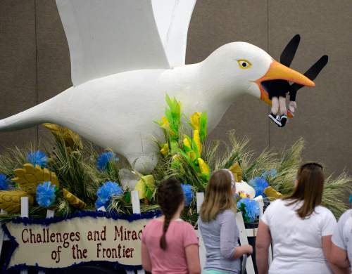 Al Hartmann  |  The Salt Lake Tribune
Salt Lake Big Cottonwood Stake's float, "Challenges and Miracles of the Frontier," features a friendly looking cricket in the beak of a friendly seagull. Thousands attended the Pioneer Day Float Preview Party at the South Towne Exposition Center in Sandy on Tuesday. This year's Days of '47 theme is "Pioneers: Forging a New Frontier."
